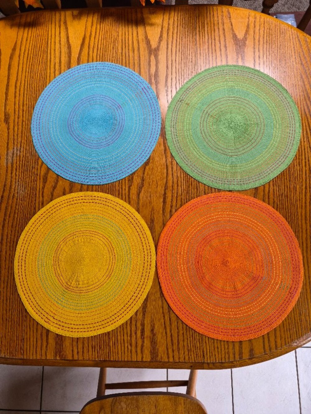 Set of 4 Round Woven Placemats - Blue, Green, Yellow, Orange